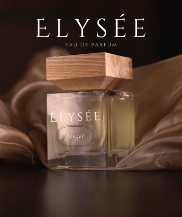 A bottle of ELYSÉE eau de parfum on a silky fabric with a wooden cap.